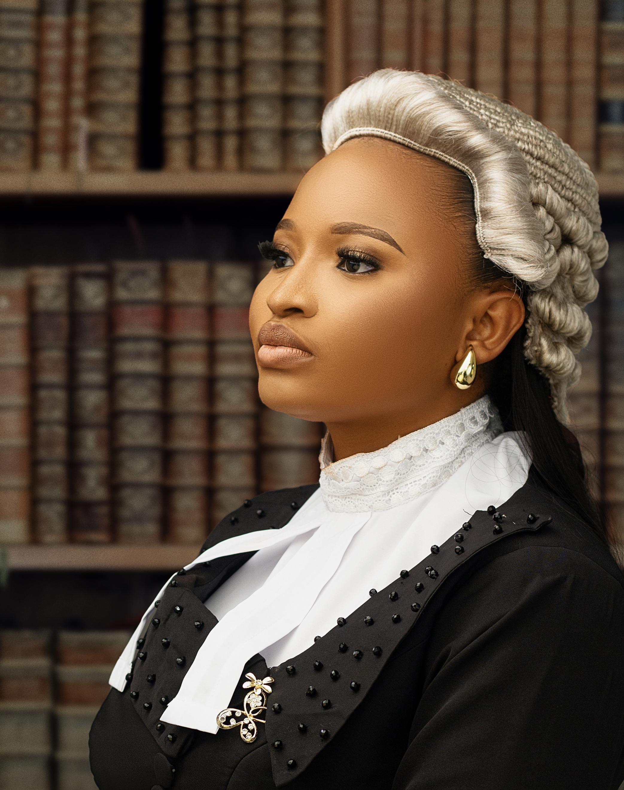 A professional headshot of Elizabeth Ujah-Martins Esq.